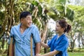 Asian Young Female Doctor Help Support Senior Patient and Provide Encouragement During Treatment. Rehabilitation or Physical Royalty Free Stock Photo