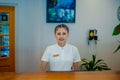 Asian young female receptionist working on duty at the tropical resort