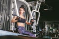 Asian young fitness woman execute exercise with exercise-machine in gym Royalty Free Stock Photo