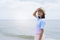 Asian young girl having fun at the beautiful sea