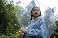 Asian young girl wear jean coat in rain