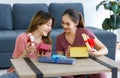 Asian young happy cheerful female teenager LGBTQ lesbian lover couple sitting smiling together on carpet floor in living room Royalty Free Stock Photo