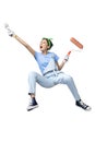 Asian young housewife in glove holding a roller paint brush and paint brush Royalty Free Stock Photo