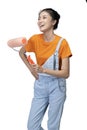 Asian young housewife holding roller paint brush Royalty Free Stock Photo