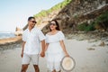 asian young lovely couple hold hands walking stroll together at beach Royalty Free Stock Photo