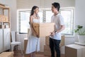 Asian young lovers help packing things in boxes Royalty Free Stock Photo