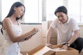 Asia young lovers help packing things in boxes, They prepare to move to a new home. Royalty Free Stock Photo