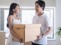 Asian young lovers help packing things in boxes Royalty Free Stock Photo