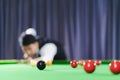 aiming snooker ball With a professional, focus on the black ball