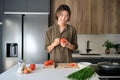 Asian young man cooking at kitchen. Royalty Free Stock Photo