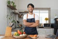 An Asian young man cooking , preparing breakfast with healthy food in kitchen at home , healthy lifestyle Royalty Free Stock Photo