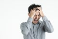 Asian young man emotionally suffering Royalty Free Stock Photo