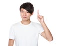 Asian young man finger point upwards Royalty Free Stock Photo