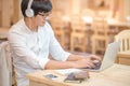 Asian young man with headphones listening to music Royalty Free Stock Photo