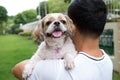 Asian young man with his Shih Tze dog