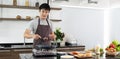 Asian young man prepared the ingredients to cook the hamburger at home Royalty Free Stock Photo