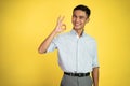 asian young man showing okay hand gesture with smiling Royalty Free Stock Photo