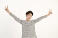Asian young man with two finger peace sign hand gesture Royalty Free Stock Photo