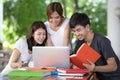 Asian young man and woman sitting pointing studying examining