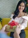 The asian young man proposed the beautiful woman for marry with the engagement ring in red heart box Royalty Free Stock Photo