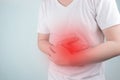 Asian Young men are suffering from stomach ulcers. gastritis Caused by the infection of H. pylori bacteria healthcare and health Royalty Free Stock Photo