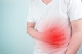 Asian Young men are suffering from stomach ulcers. gastritis Caused by the infection of H. pylori bacteria healthcare and health Royalty Free Stock Photo