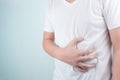 Asian Young men are suffering from stomach ulcers. gastritis Caused by the infection of H. pylori bacteria healthcare and health Royalty Free Stock Photo