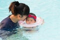 Asian young mother and cute eight month baby enjoying swimming p Royalty Free Stock Photo