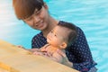 Asian young mother and cute eight month baby enjoying swimming p Royalty Free Stock Photo