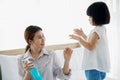 Asian Young mother washes her little girl`s hand by using a hand wash sanitizer gel. In the epidemic virus situation