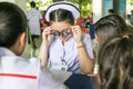 An Asian young nurse doing vision testing using optical trial fr