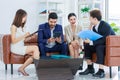 Asian young professional successful professional, business man and business woman in formal suit holding tablet computer, document Royalty Free Stock Photo