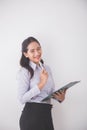 Asian Young secretary smiling while holding a clipboard. white b