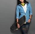 Asian young skater girl holding a skateboard Royalty Free Stock Photo