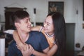 Asian young smiling couple in love, Man sitting on the sofa and holding hands women and kissed, Happy cheerful family.Asian young Royalty Free Stock Photo