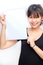 Asian young smiling woman holding blank business paper card Royalty Free Stock Photo