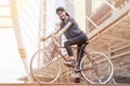 asian young sport woman in sportswear ride a bicycle in city . morning