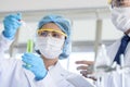 Asian young student scientist researching and learning with senior scientist have teaching in a laboratory Royalty Free Stock Photo