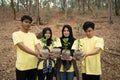 Asian young of volunteers carrying new trees Royalty Free Stock Photo