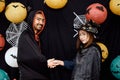 Asian young wizard Halloween man portrait standing with witch Halloween woman shaking hand