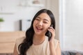 Asian young woman answer the phone and talking with positive and happiness emotional.Attractive female talkin in smartphone smile Royalty Free Stock Photo