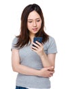 Asian young woman check on the cellphone Royalty Free Stock Photo