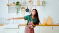 Asian young woman dancing in kitchen room Royalty Free Stock Photo