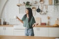 Asian young woman dancing in kitchen room Royalty Free Stock Photo