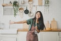 Asian young woman dancing in kitchen room Royalty Free Stock Photo