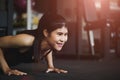 Asian young woman doing push-ups at the gym. Royalty Free Stock Photo