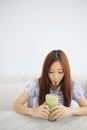 Asian young woman drinking Iced green tea latte in white coffeeshop Royalty Free Stock Photo