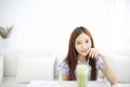 Asian young woman drinking Iced green tea latte in white coffeeshop Royalty Free Stock Photo