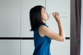 Asian woman drink water from bottle after wake up,Concept of good health Royalty Free Stock Photo