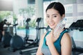 Asian young woman drinking water after exercise in sport club Royalty Free Stock Photo